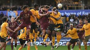 John Stones' dramatic stoppage-time winner kept Manchester City in touch with Premier League leaders Liverpool as the champions beat battling Wolves.