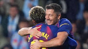 Robert Lewandowski scored a brilliant hat-trick to help Barcelona move within three points of La Liga leaders Real Madrid with victory at Celta Vigo.