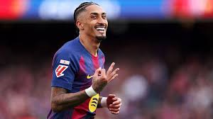 Raphinha scored a hat-trick as La Liga leaders Barcelona easily beat struggling Sevilla.