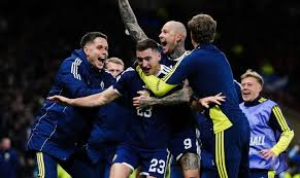 Scotland will go to the men's World Cup for the first time in 28 years after two stoppage-time goals on an astonishing night of drama sunk group favourites Denmark at a bouncing Hampden Park.