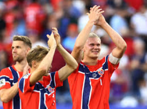 Erling Haaland scored twice on his World Cup debut as Norway overcame a spirited Iraq in their opening Group I game at Boston Stadium.