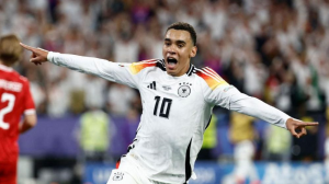 Jamal Musiala and Kai Havertz scored as Euro 2024 hosts Germany reached the quarter-finals by beating Denmark in a game that was interrupted by a spectacular storm.