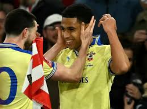 Arsenal were stung by a late goal from Southampton's Shea Charles as the Premier League leaders fell to defeat in the FA Cup quarter-finals.