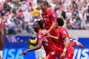 Substitute Johan Manzambi scored twice as Switzerland beat Bosnia-Herzegovina 4-1 in a chaotic final 20 minutes to edge towards a place in the World Cup last 32.